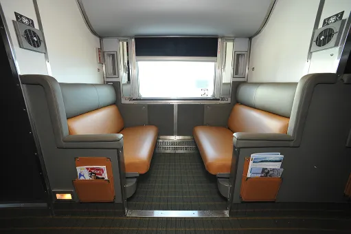 View of the Sleeper Plus cabin, with seats folded out during the day.