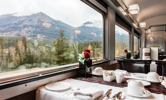 Dining car with panoramic windows, passing through the Canadian Rockies