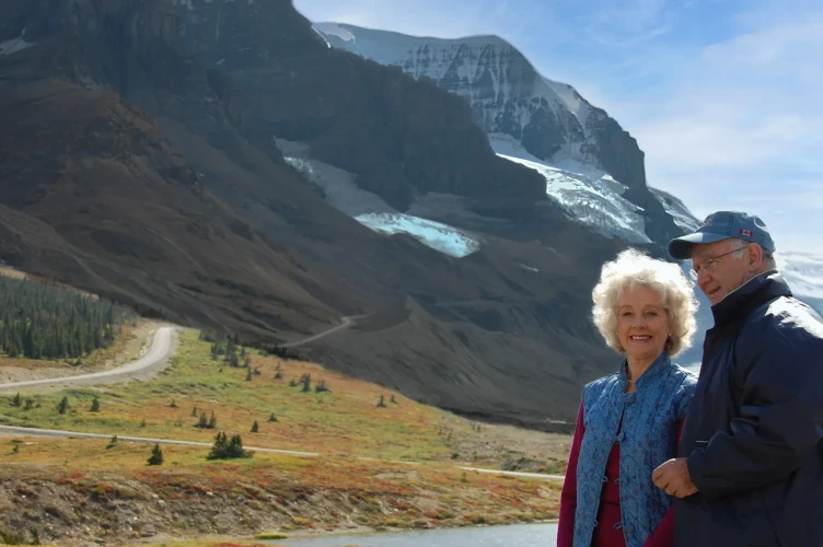 An elderly couple enjoying the Athabasca glacier.