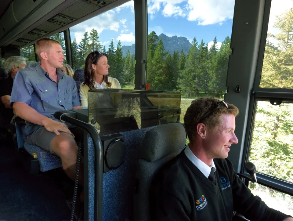 Guided bus tour taking travellers from Vancouver to Jasper