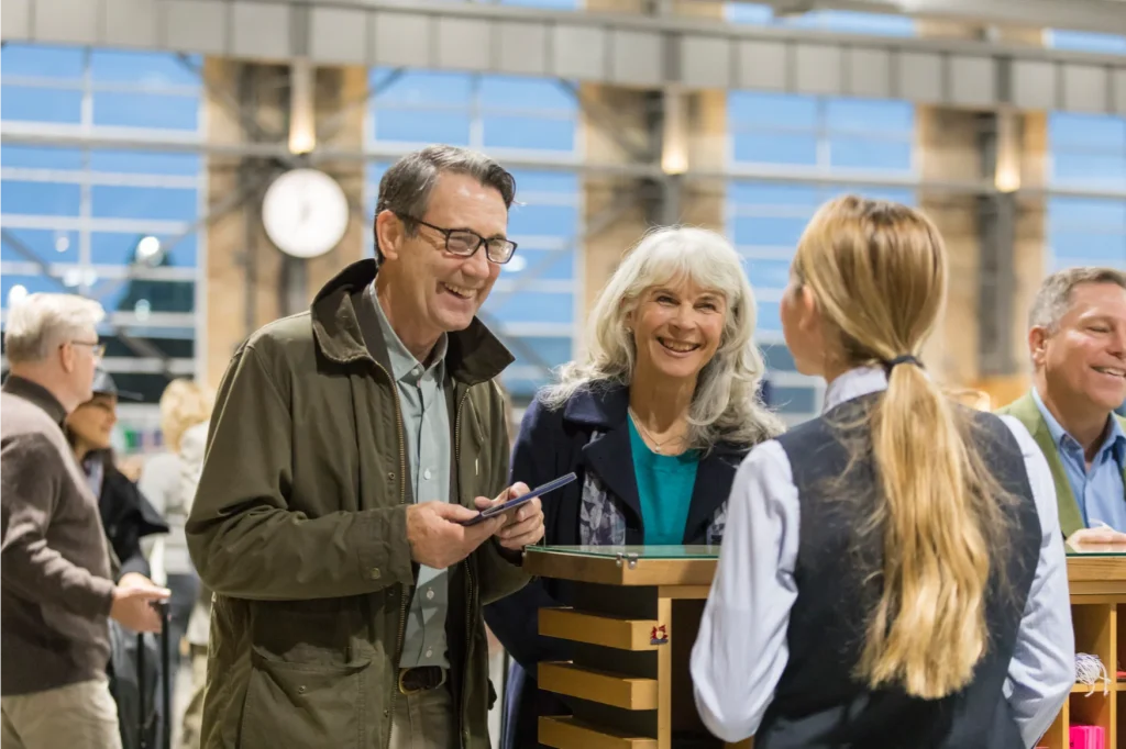 Two customers checking in for their Rocky Mountaineer Journey