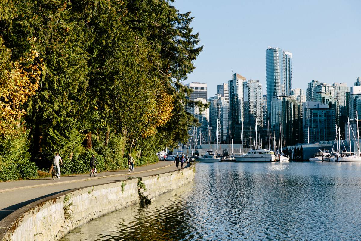 Cyclists and pedestrians riding around Stanley Park in Vancouver