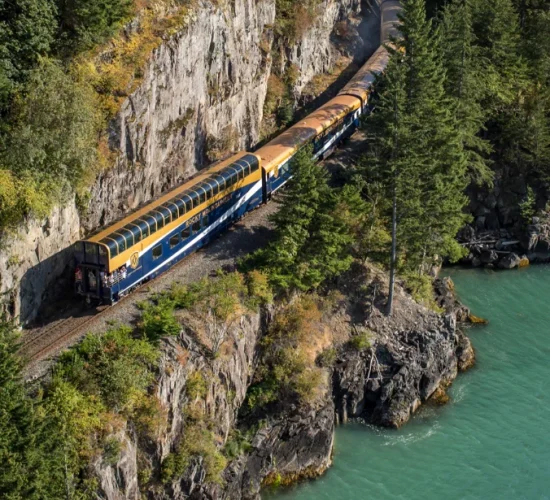 Exterior of Rocky Mountaineer Train travelling along Sea-to-Sky Corridor on the Rainforest to Gold Rush route.